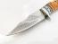 Ловен нож ръчно направен от дамаска японска стомана,дръжка от кориан имитиращ еленов рог и метален гард